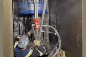 KJs Cutting staff on ladder cutting ceiling hole